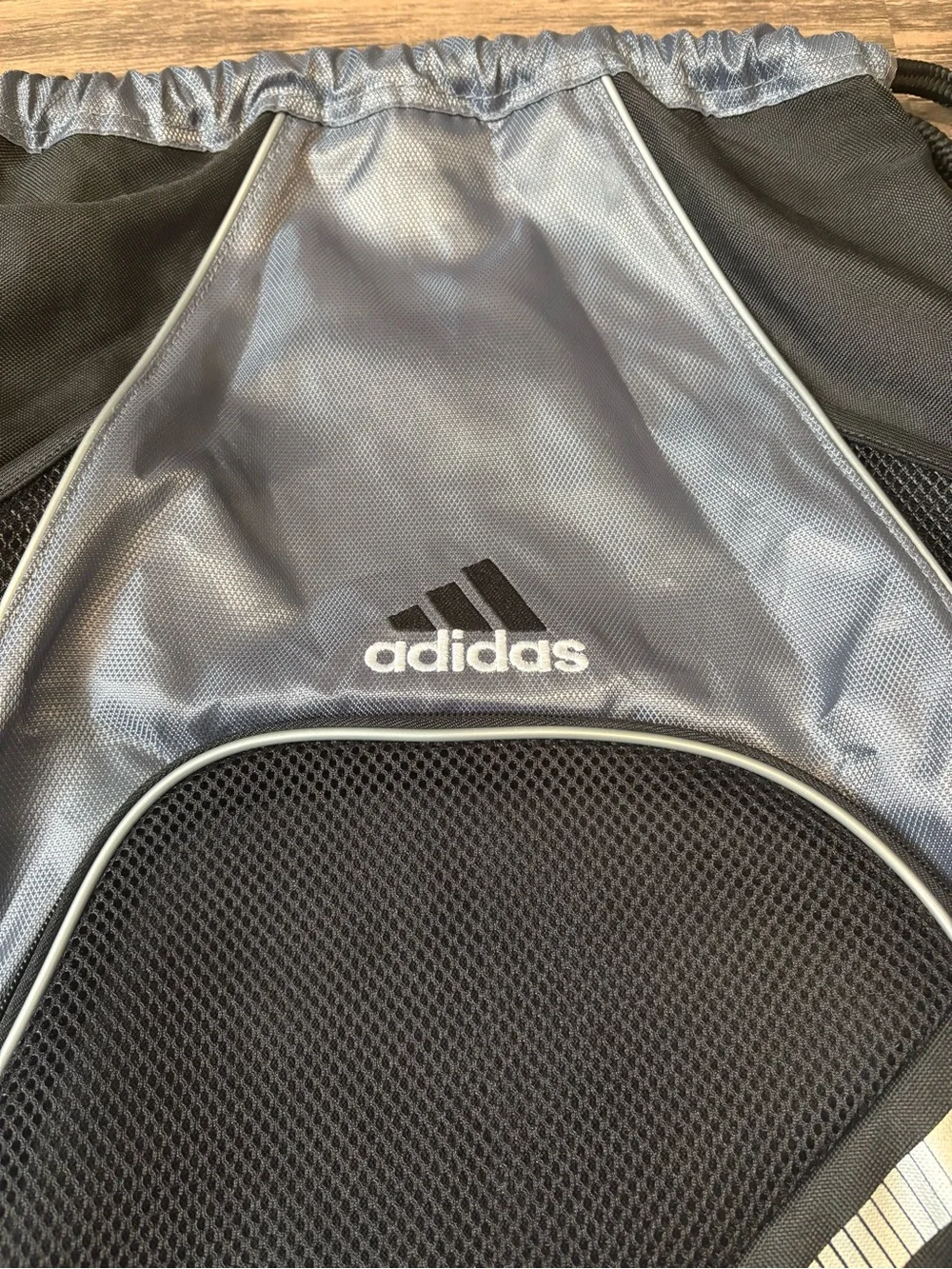 adidas Black and Silver Drawstring Backpack with Front Zip Pocket